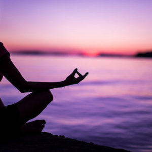 silhouette woman meditating